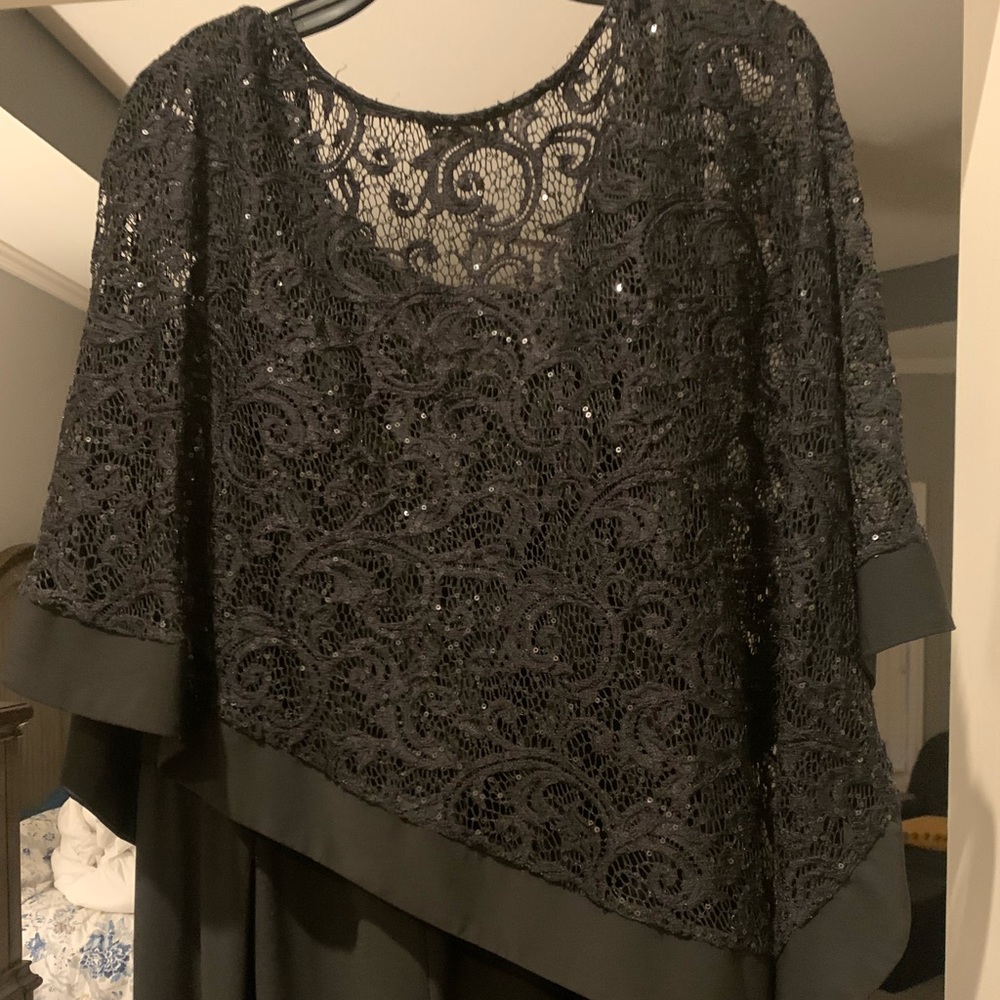 Size 16 Black jumpsuit with built in lace coverup. This looks so nice on!